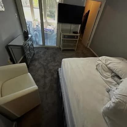 Plush carpet installed in a bedroom by Providence Flooring